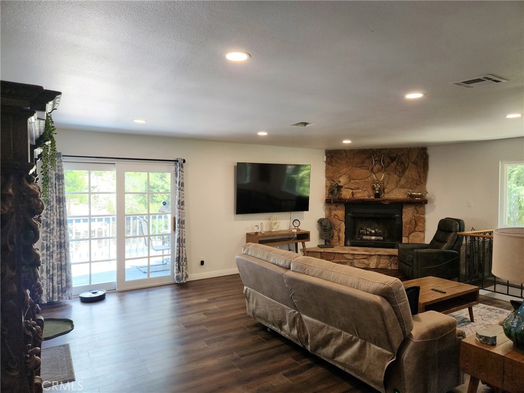 25935 Ranger Drive Twin Peaks, CA 92391 - Photo 4 of 30 a living room with furniture and a flat screen tv
