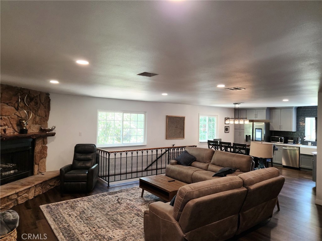 25935 Ranger Drive Twin Peaks, CA 92391 - Photo 7 of 30 a living room with furniture a flat screen tv and a fireplace