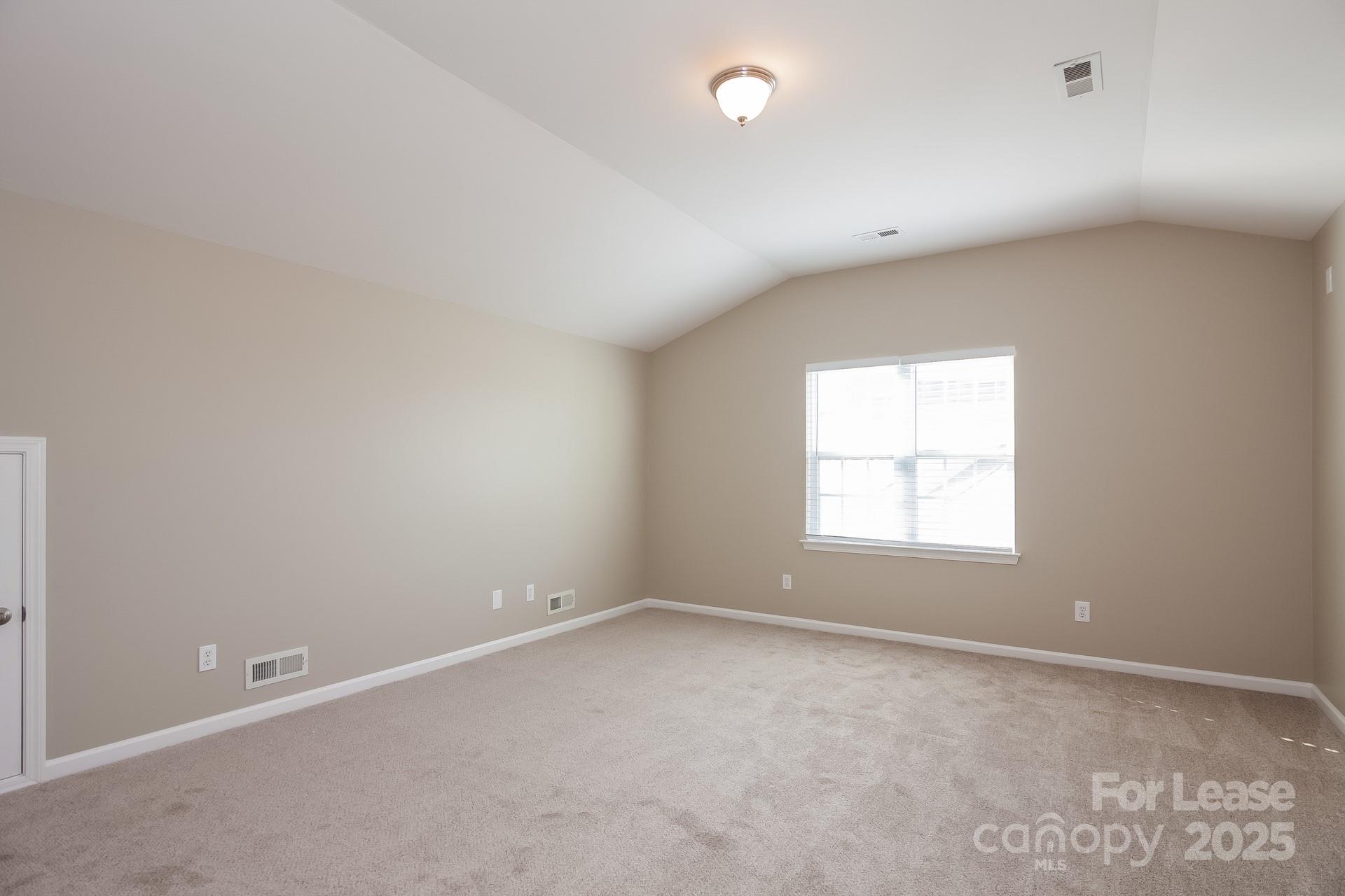 10209 Fairbourne Court Charlotte, NC 28269 - Photo 12 of 15 an empty room with a window