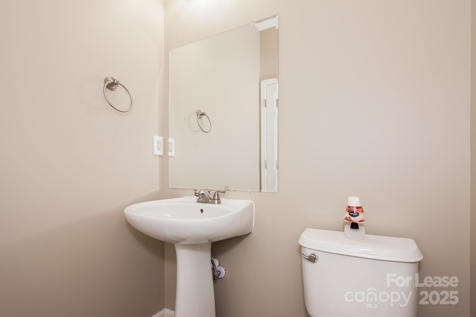 10209 Fairbourne Court Charlotte, NC 28269 - Photo 6 of 15 a bathroom with a sink toilet and a mirror