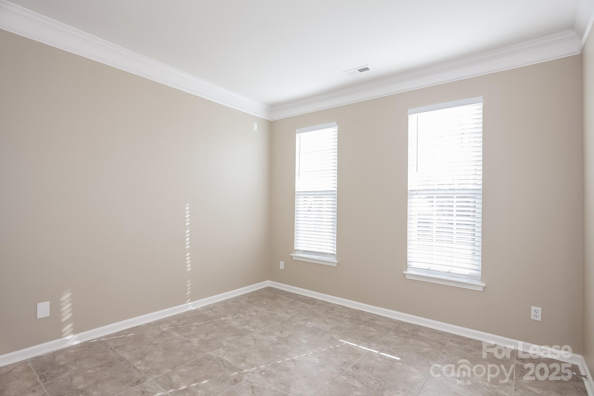 10209 Fairbourne Court Charlotte, NC 28269 - Photo 9 of 15 a view of an empty room with a window