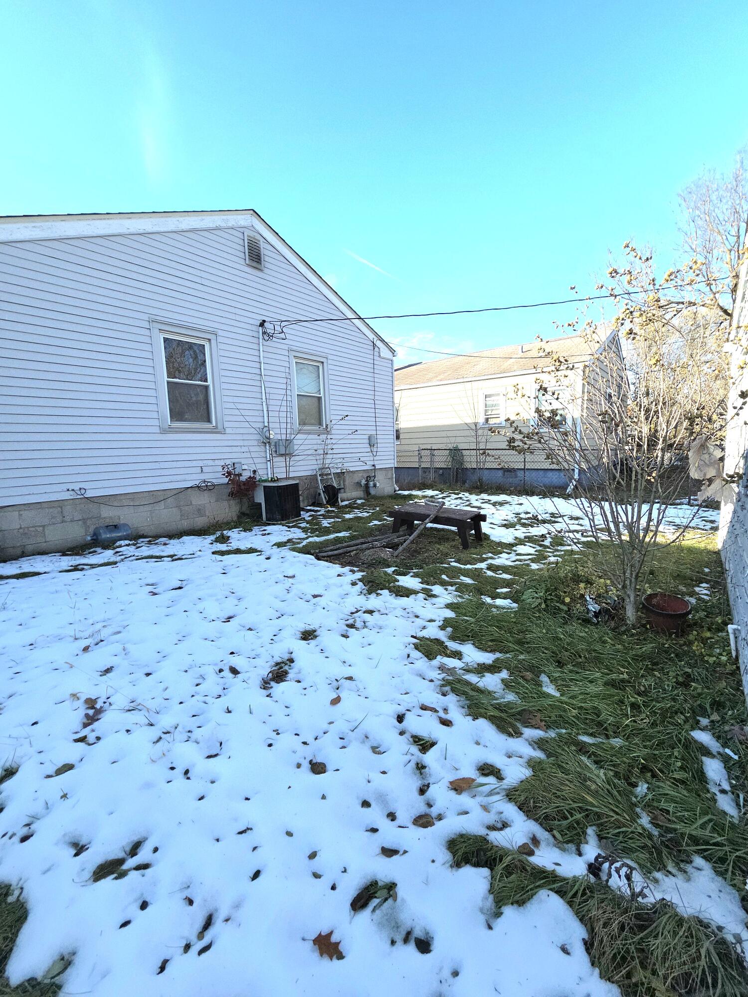 4115 Fillmore Street Gary, IN 46408 - Photo 13 of 16 a backyard of a house with lots of green space