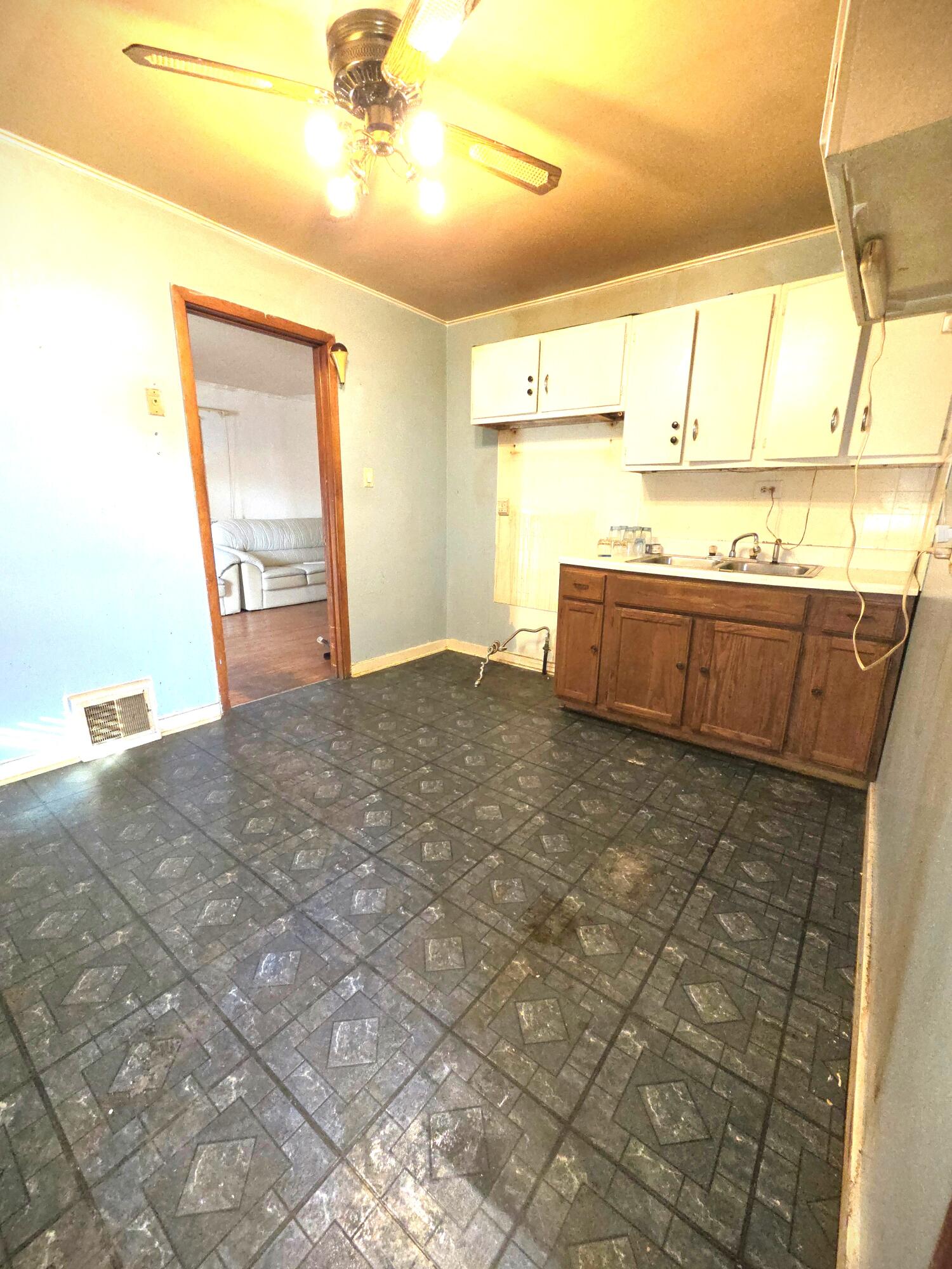 4115 Fillmore Street Gary, IN 46408 - Photo 3 of 16 a view of a kitchen with a sink and a window