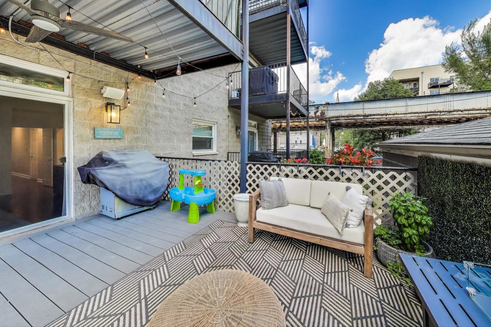 1533 North Cleveland Avenue, Unit 1S Chicago, IL 60610 - Photo 19 of 36 a view of a patio with couches table and chairs and potted plants