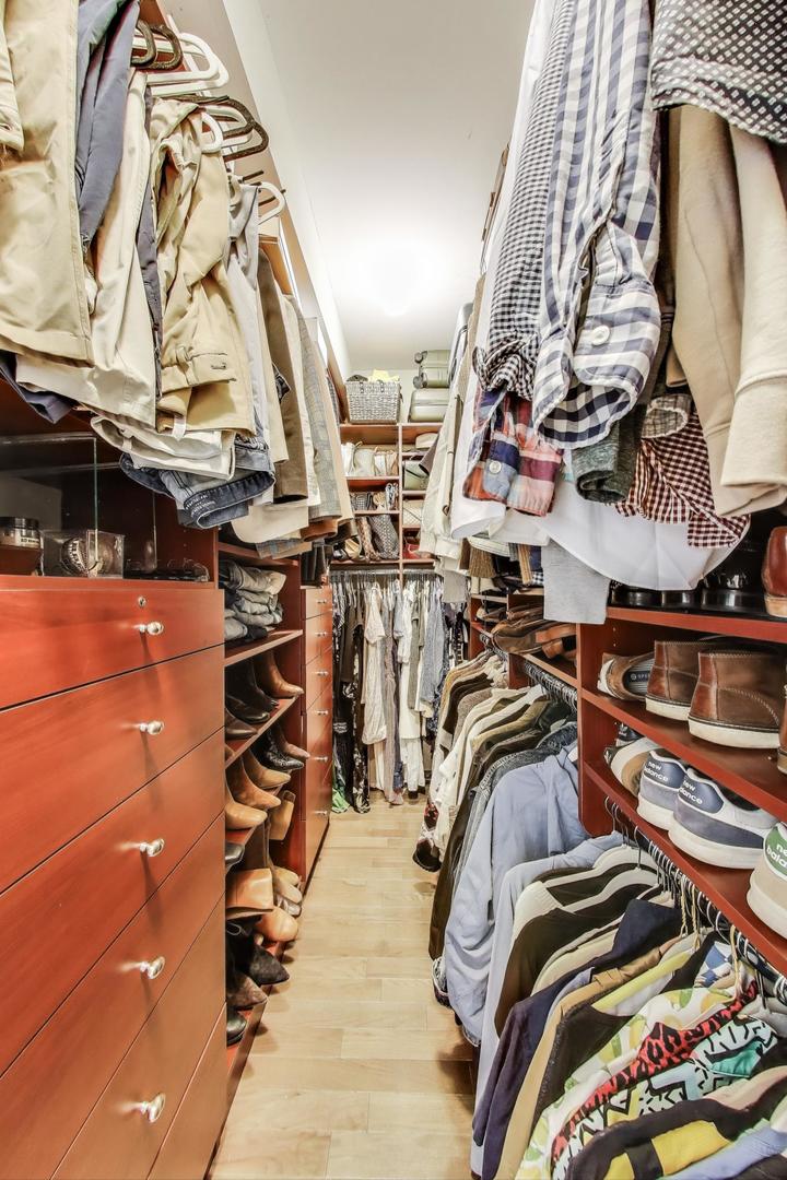 1533 North Cleveland Avenue, Unit 1S Chicago, IL 60610 - Photo 21 of 36 a view of walk in closet with clothes and shoes