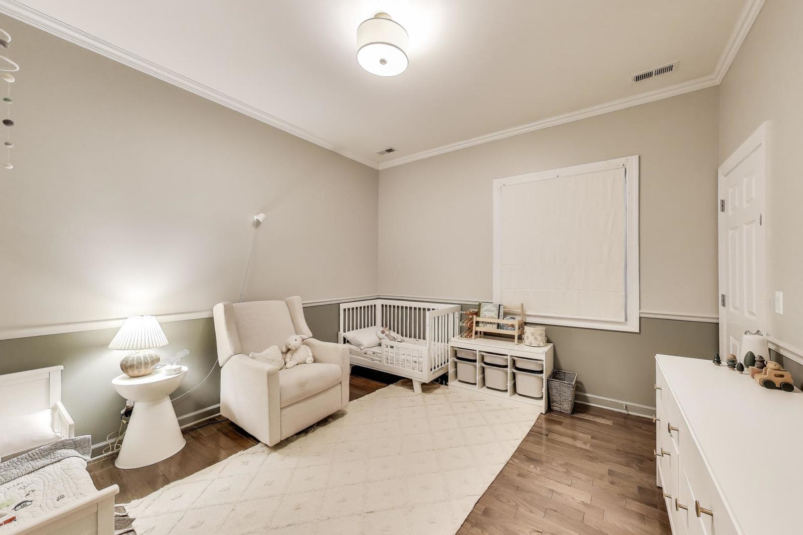1533 North Cleveland Avenue, Unit 1S Chicago, IL 60610 - Photo 22 of 36 a living room with furniture and a table