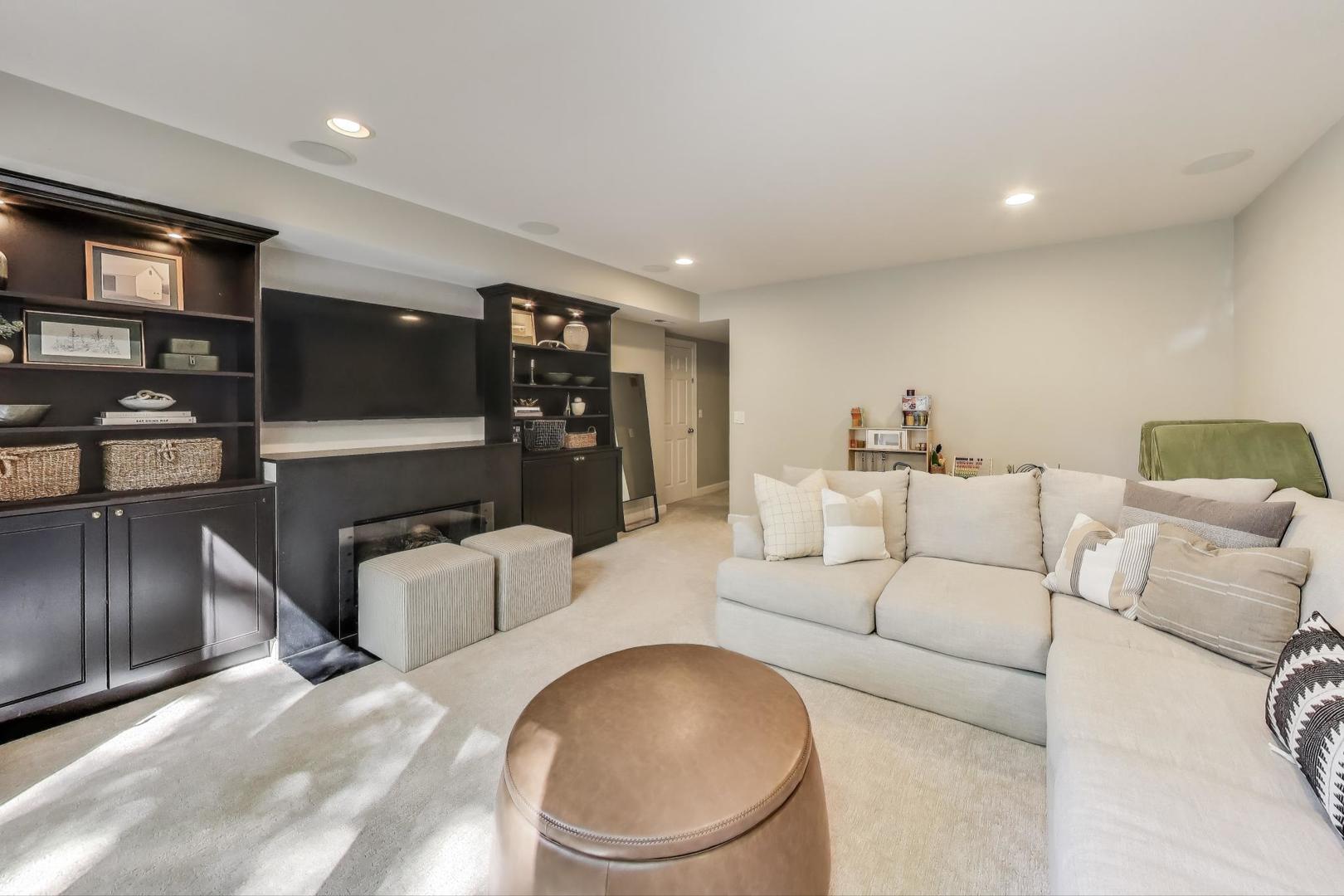 1533 North Cleveland Avenue, Unit 1S Chicago, IL 60610 - Photo 26 of 36 a living room with furniture and a flat screen tv