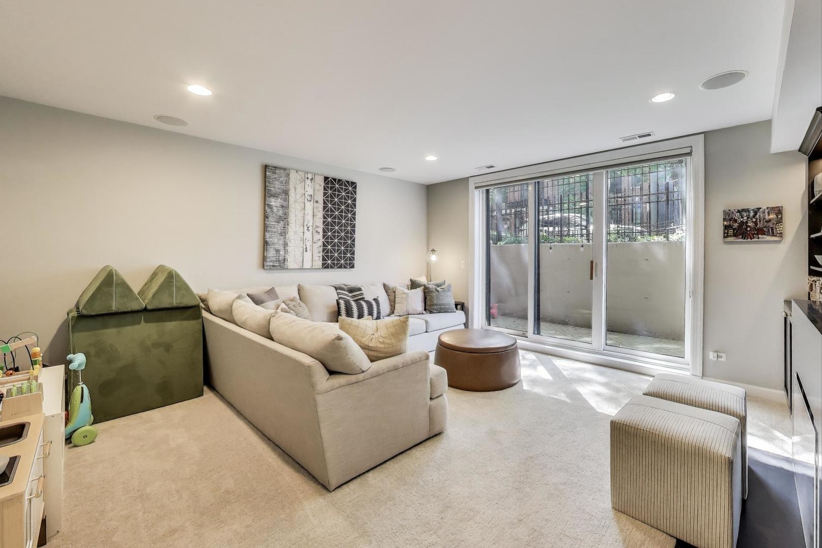 1533 North Cleveland Avenue, Unit 1S Chicago, IL 60610 - Photo 28 of 36 a living room with furniture and a potted plant