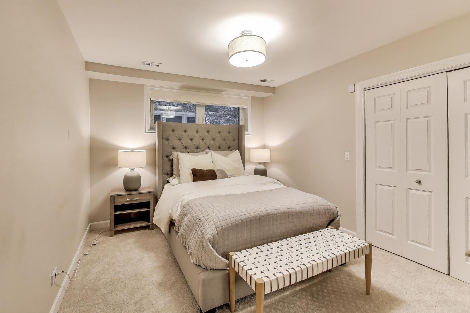 1533 North Cleveland Avenue, Unit 1S Chicago, IL 60610 - Photo 31 of 36 a bedroom with a bed and a lamp