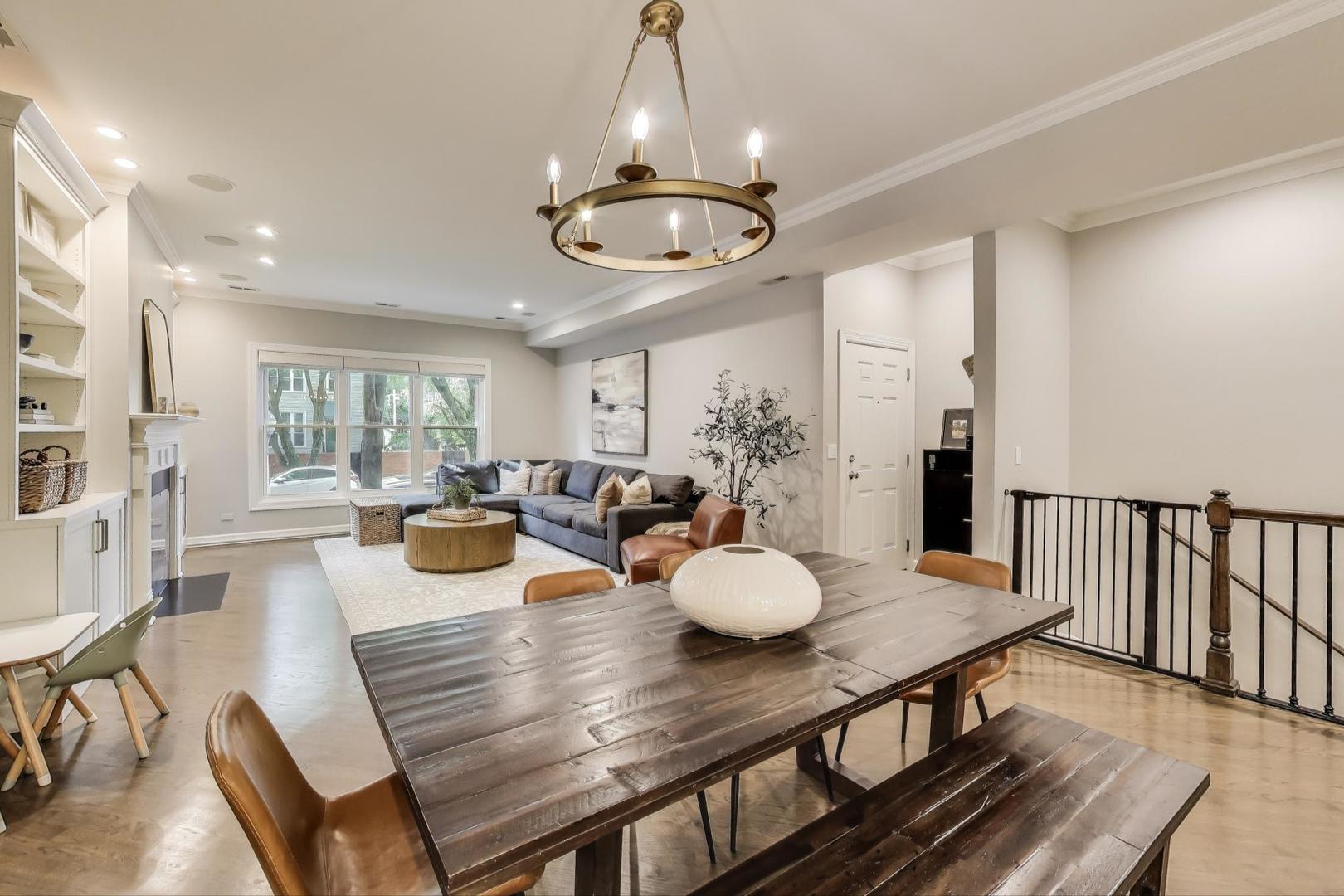 1533 North Cleveland Avenue, Unit 1S Chicago, IL 60610 - Photo 4 of 36 a view of a dining room with furniture and wooden floor