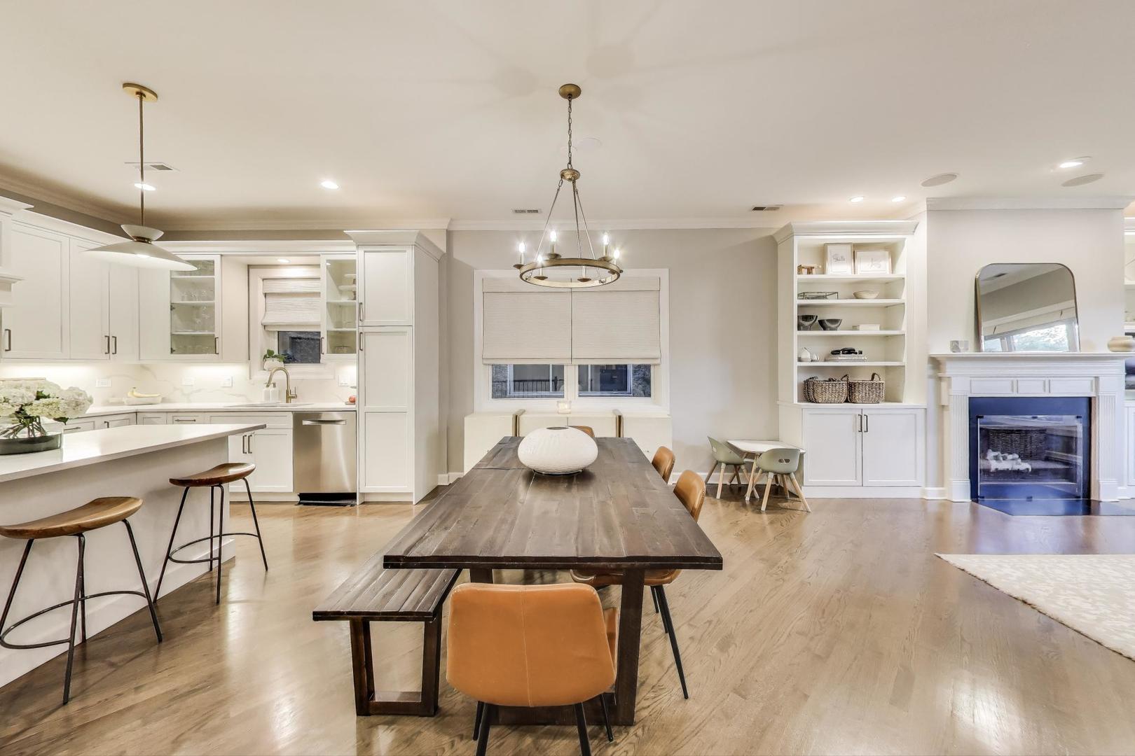 1533 North Cleveland Avenue, Unit 1S Chicago, IL 60610 - Photo 6 of 36 a view of a dining room with furniture window and wooden floor
