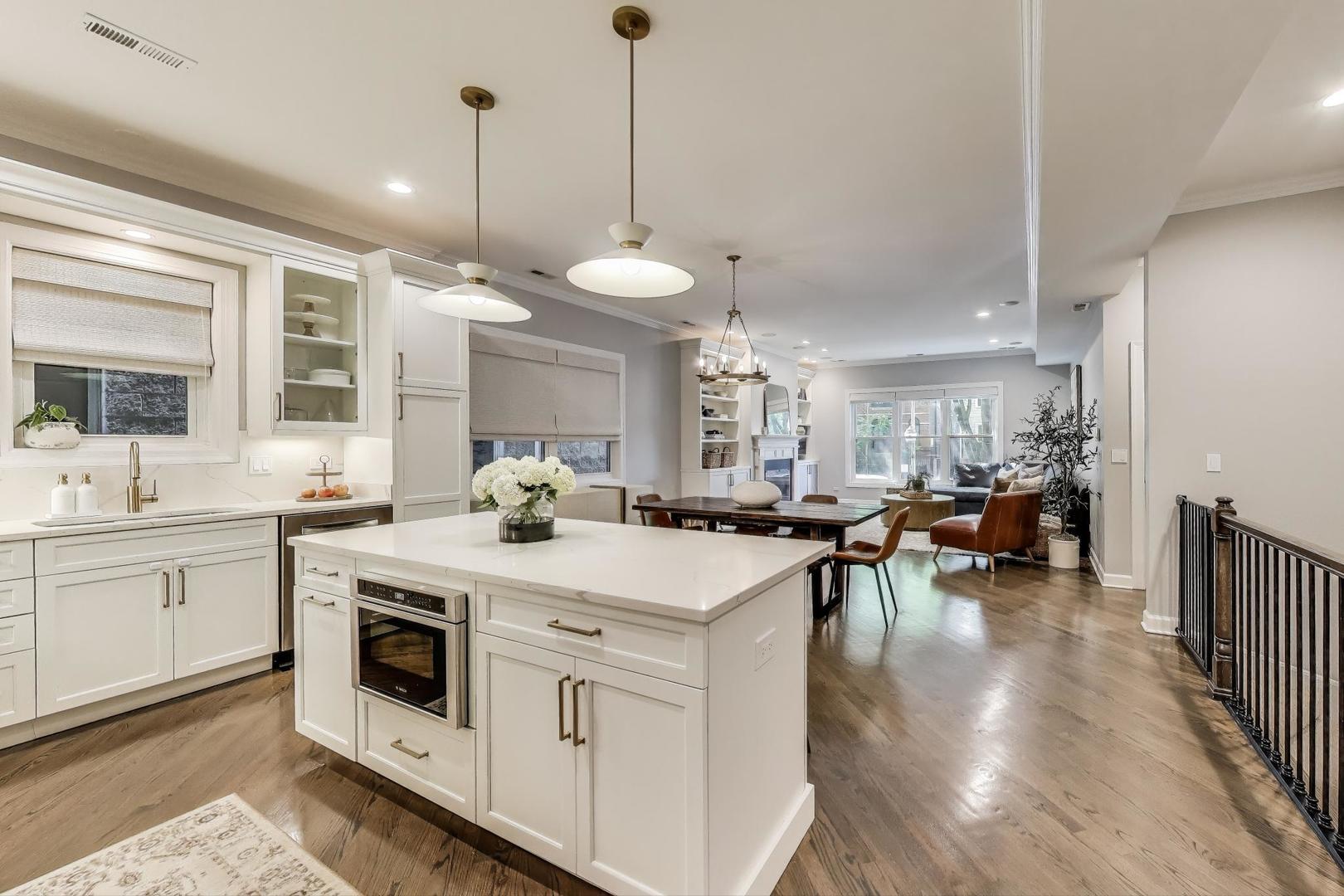 1533 North Cleveland Avenue, Unit 1S Chicago, IL 60610 - Photo 8 of 36 a kitchen with a stove a sink and a refrigerator