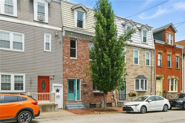 a car parked in front of a house
