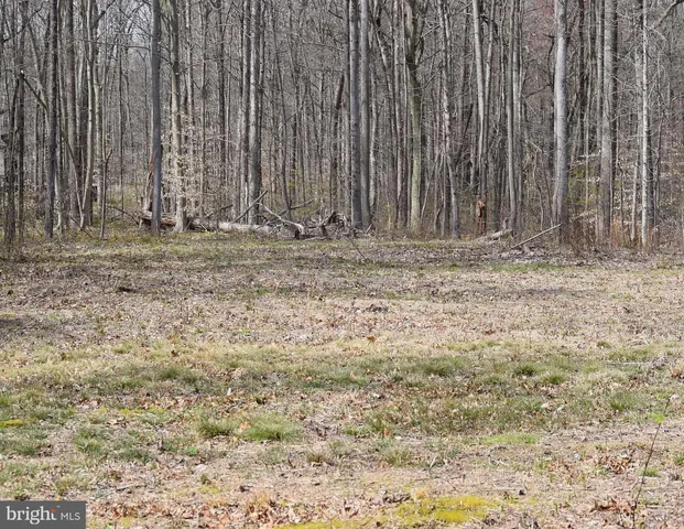 a view of water heater room with wooden fence
