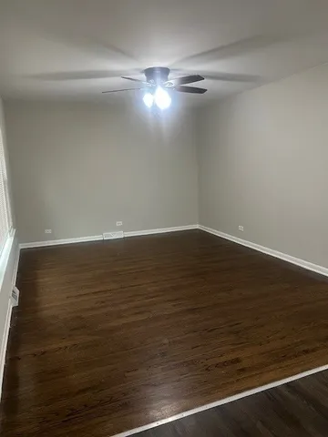 a view of room with wooden floor