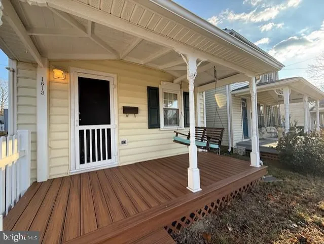 a view of a house with porch and wooden floor
