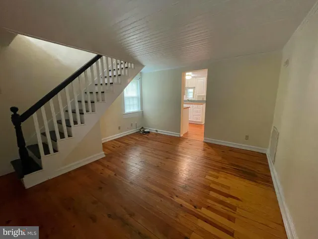 a view of an entryway with wooden floor