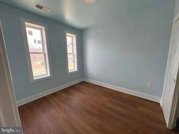 a bathroom with a shower and toilet