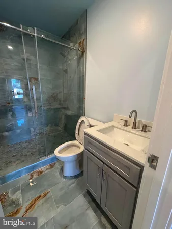 a kitchen with stainless steel appliances a refrigerator sink and cabinets