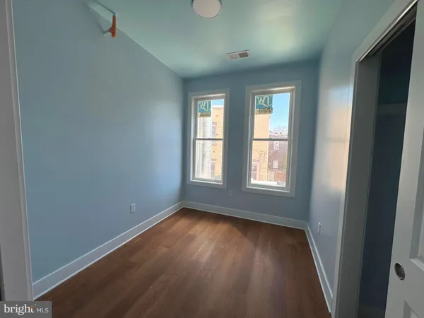 a front view of a house with a street