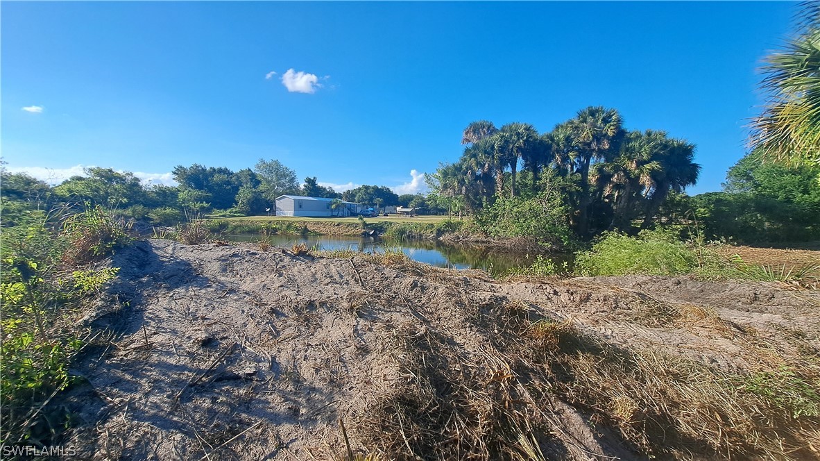 Derby Lane Moore Haven, FL 33471 - Photo 12 of 20 a view of a field with trees in the background