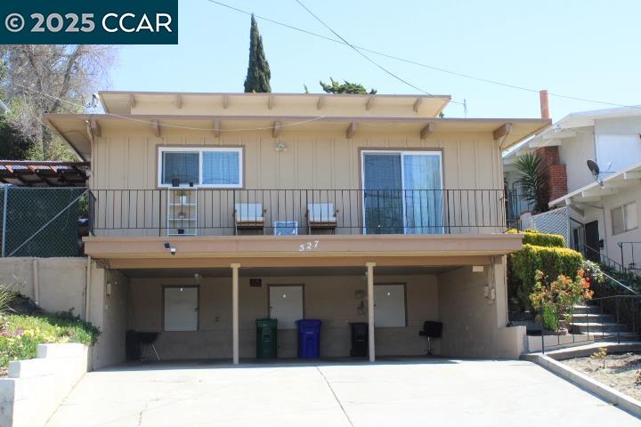 527 Vaqueros Avenue, Unit C Rodeo, CA 94572 - Photo 9 of 9 a view of a house with a barbeque grill and potted plants