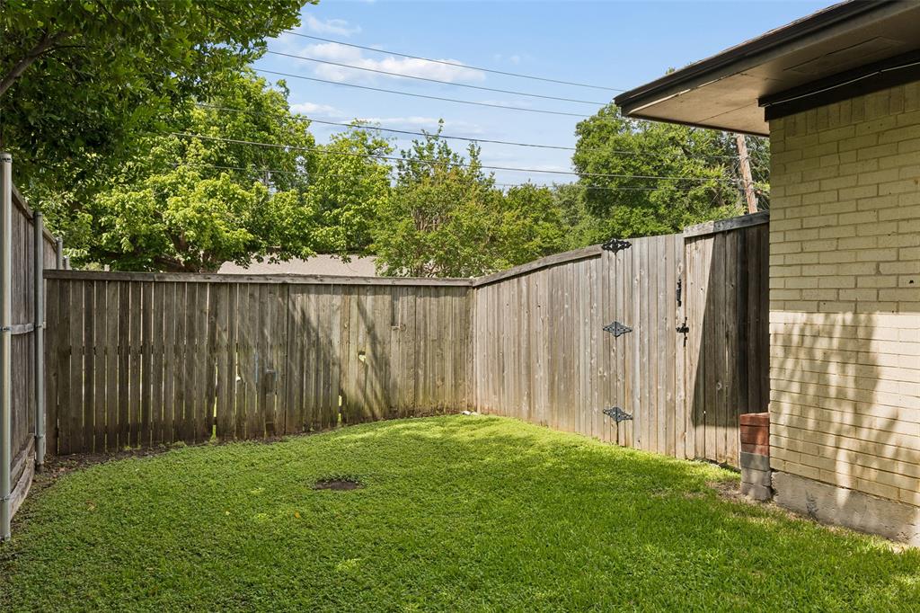 4962 Thunder Road Dallas, TX 75244 - Photo 25 of 26 Private backyard area featuring a manicured lawn and wood fencing