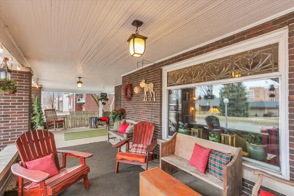 a living room with furniture a dining table and chairs with outer view