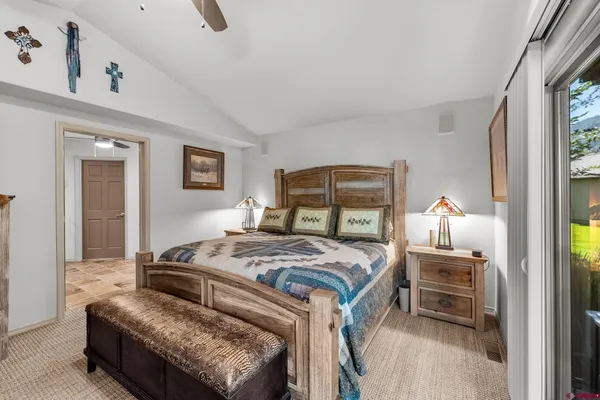 a bathroom with a granite countertop shower and a toilet