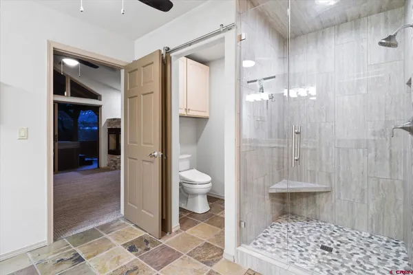a room with wooden floors and couch