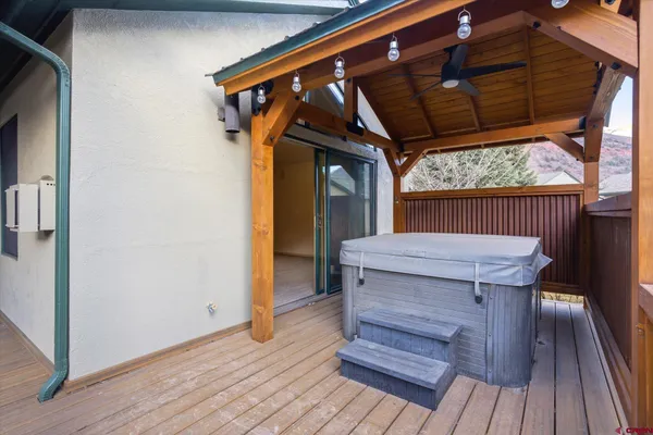 a bathroom with a granite countertop sink a large mirror and a bathtub
