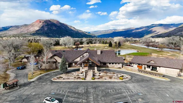 a view of multiple houses with a yard