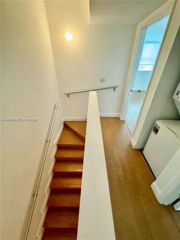 a bathroom with a shower and mirror