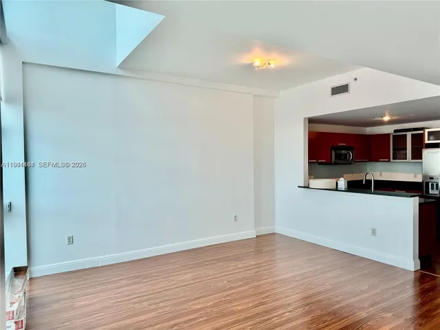 a view of a house with wooden floor and a window