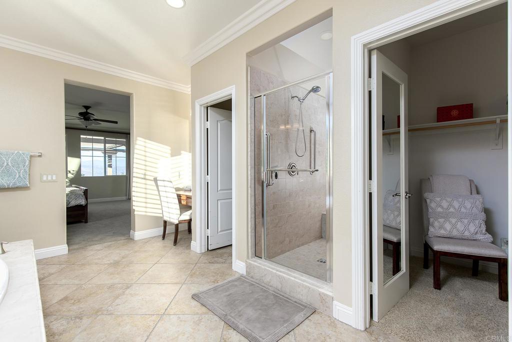 7231 Ocotillo Street Santee, CA 92071 - Photo 24 of 59 a bathroom with a glass door shower and a sink