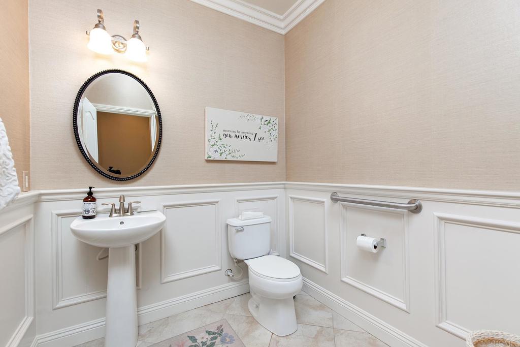 7231 Ocotillo Street Santee, CA 92071 - Photo 25 of 59 a bathroom with a toilet sink and mirror