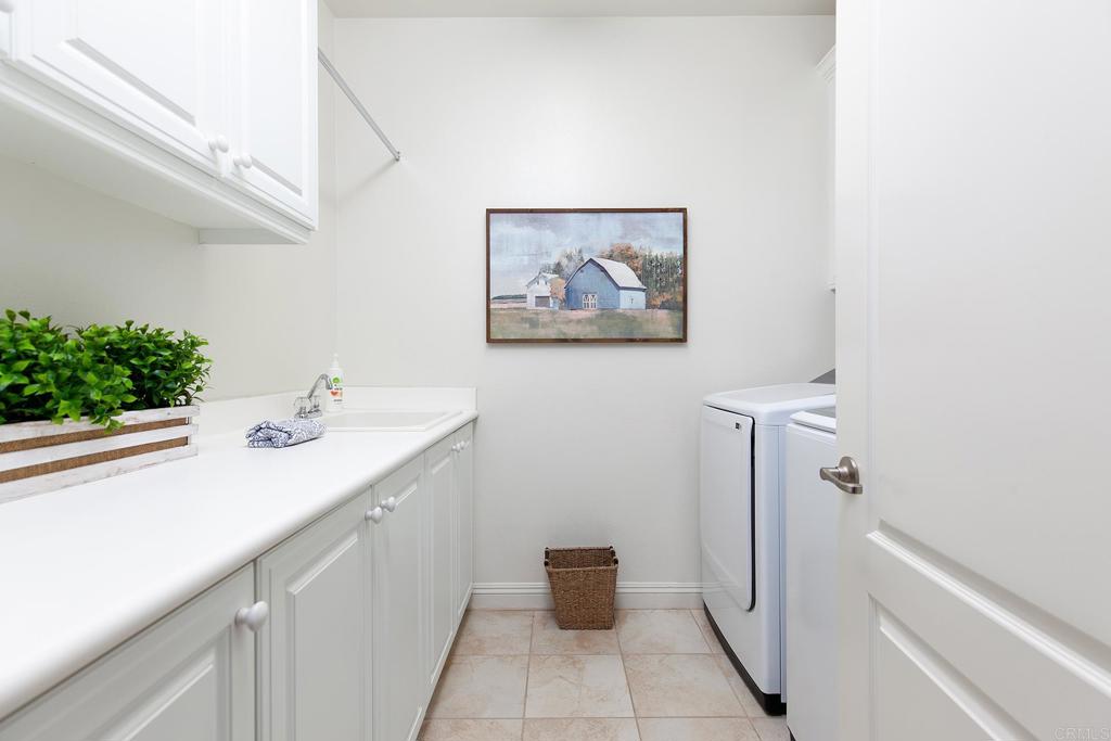 7231 Ocotillo Street Santee, CA 92071 - Photo 31 of 59 a bathroom with a sink and mirror
