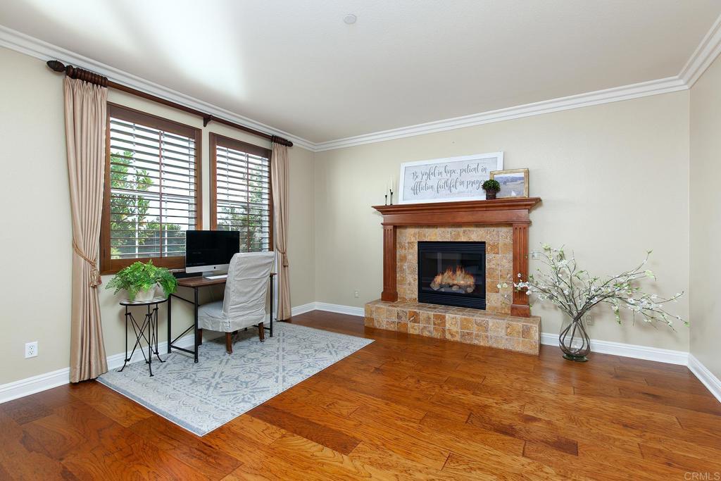 7231 Ocotillo Street Santee, CA 92071 - Photo 5 of 59 a living room with furniture a window and a fireplace