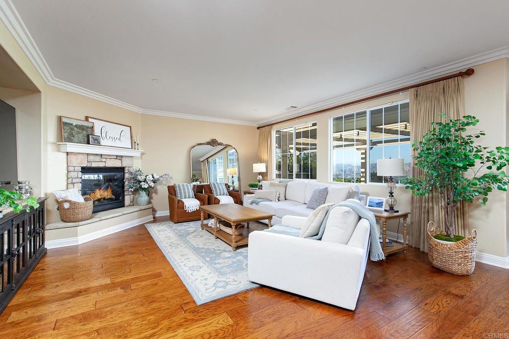 7231 Ocotillo Street Santee, CA 92071 - Photo 9 of 59 a living room with furniture large window and a fireplace