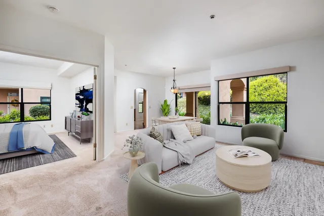 a living room with furniture and a large window