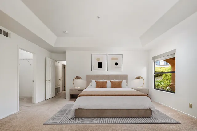 a bedroom with a bed and window