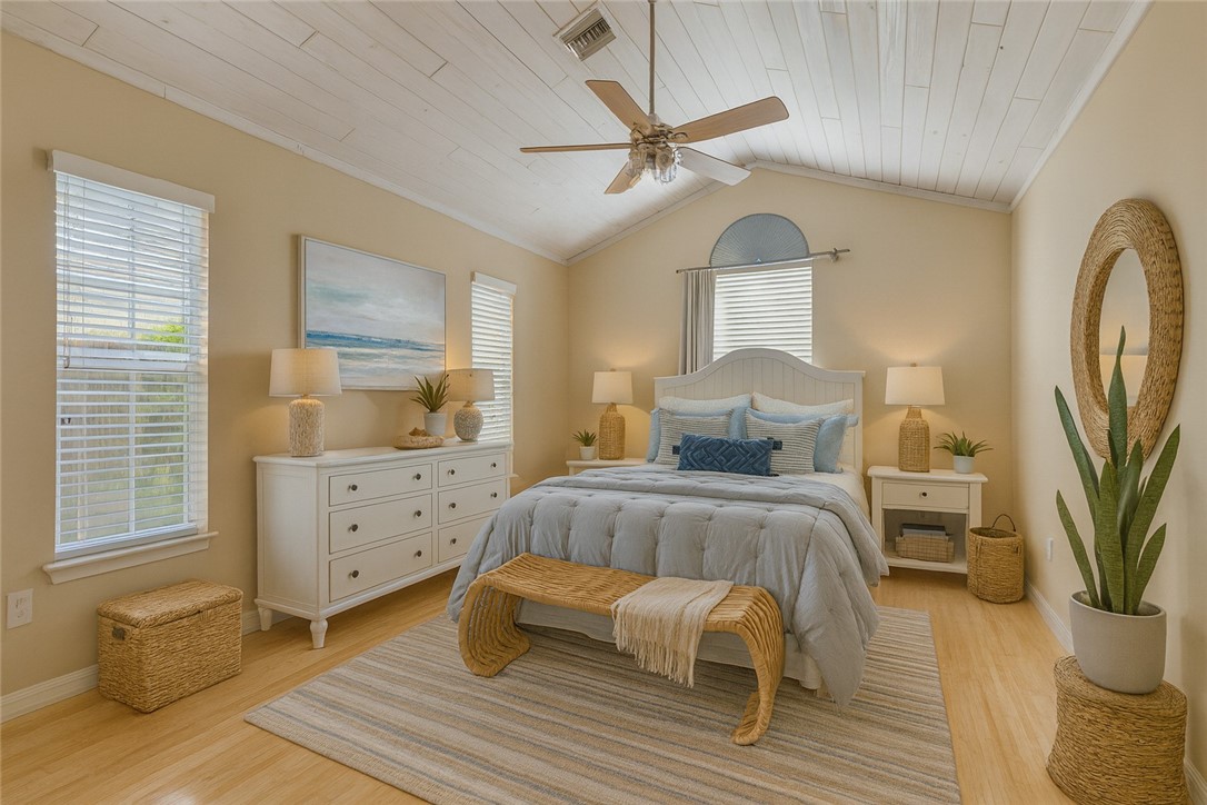 470 10th Place Southwest Vero Beach, FL 32962 - Photo 14 of 36 a bedroom with a bed and wooden floor