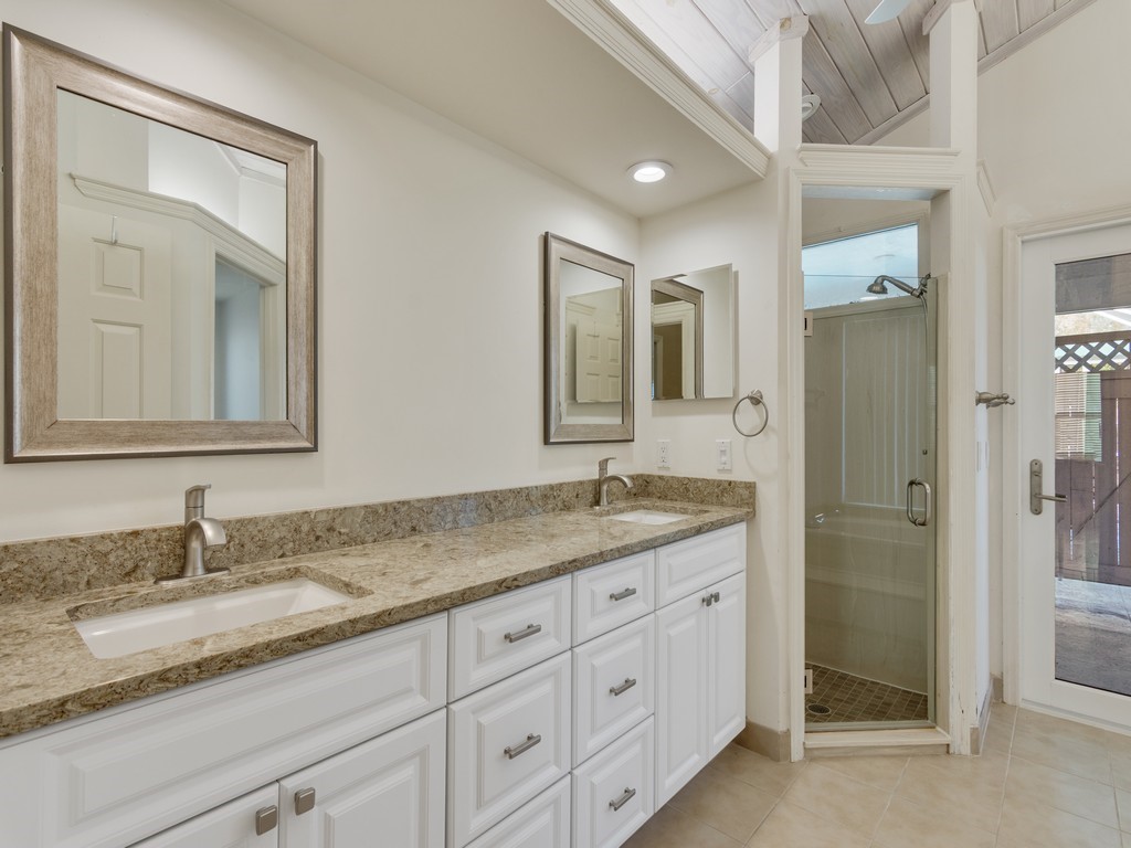 470 10th Place Southwest Vero Beach, FL 32962 - Photo 18 of 36 a bathroom with a granite countertop sink mirror and