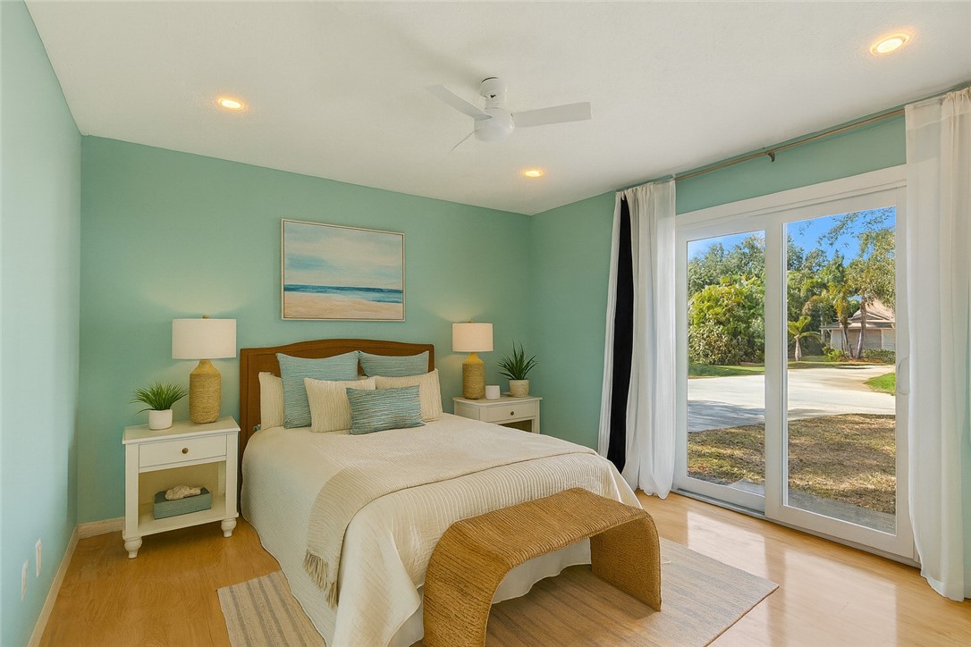 470 10th Place Southwest Vero Beach, FL 32962 - Photo 20 of 36 a bedroom with a large bed and a window