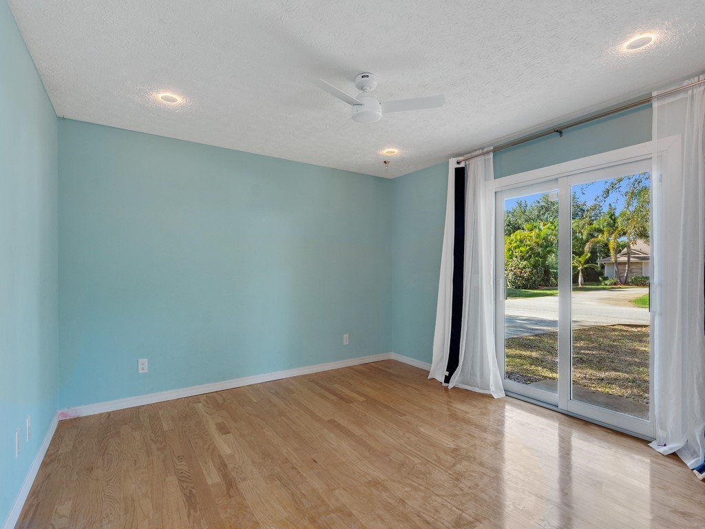 470 10th Place Southwest Vero Beach, FL 32962 - Photo 21 of 36 an empty room with wooden floor and a window