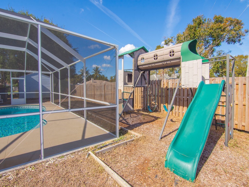 470 10th Place Southwest Vero Beach, FL 32962 - Photo 34 of 36 a view of a backyard with a swimming pool
