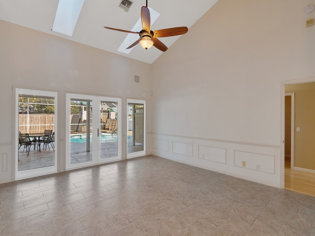 470 10th Place Southwest Vero Beach, FL 32962 - Photo 5 of 36 wooden floor in an empty room with a window