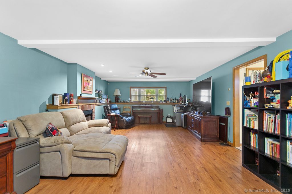 6 Stonegate Lane Shelton, CT 06484 - Photo 23 of 37 a living room with furniture and a wooden floor
