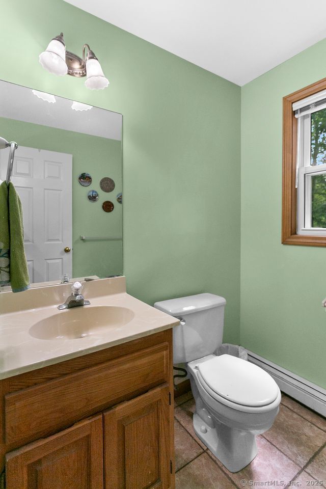 6 Stonegate Lane Shelton, CT 06484 - Photo 25 of 37 a bathroom with a sink a toilet and mirror