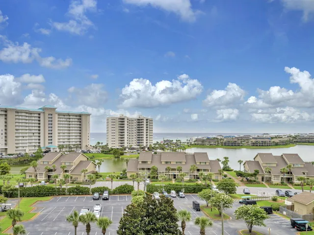 a view of a balcony with furniture